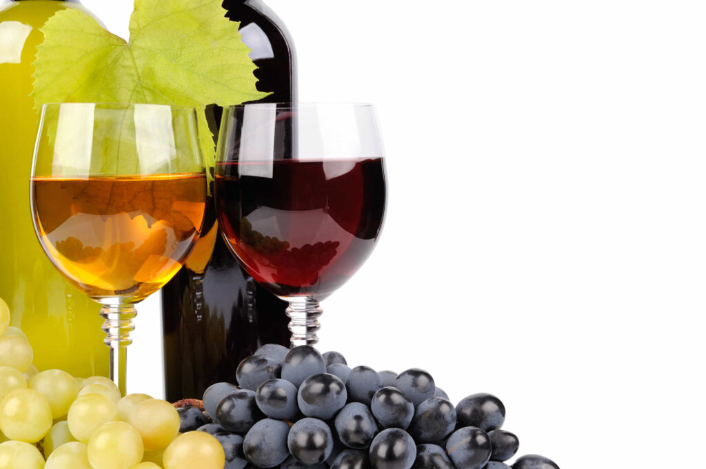 Glasses of wine with grapes